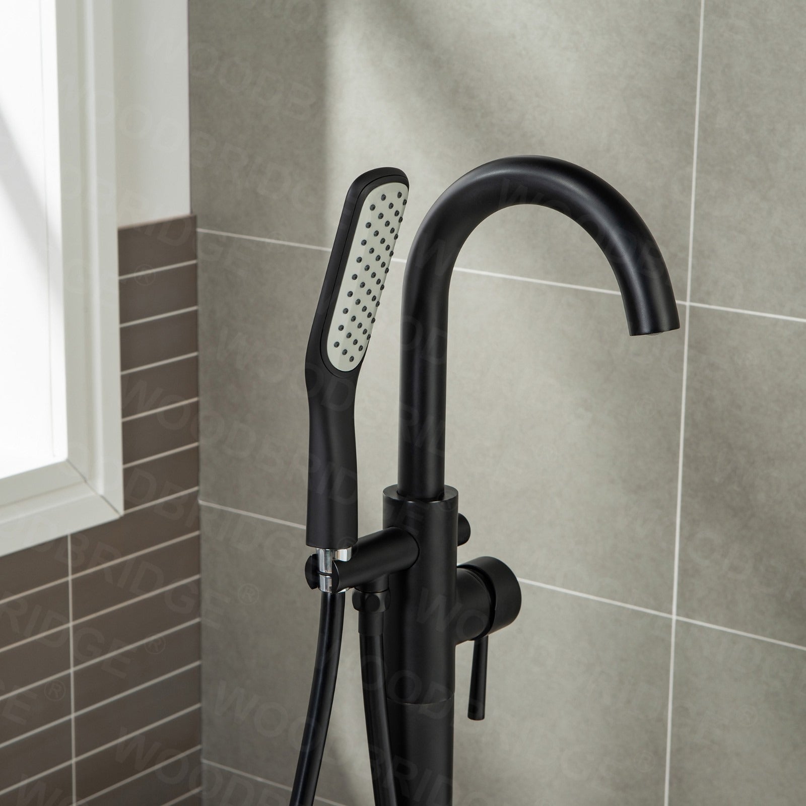 WOODBRIDGE Fusion Single Handle Floor Mount Freestanding Tub Filler Faucet with Square Comfort Grip Hand Shower