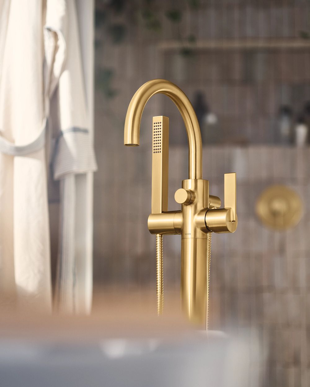 Cia one-handle tub filler includes hand shower