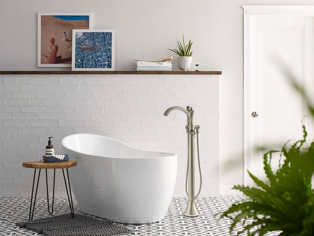 Wynford one-handle tub filler includes hand shower