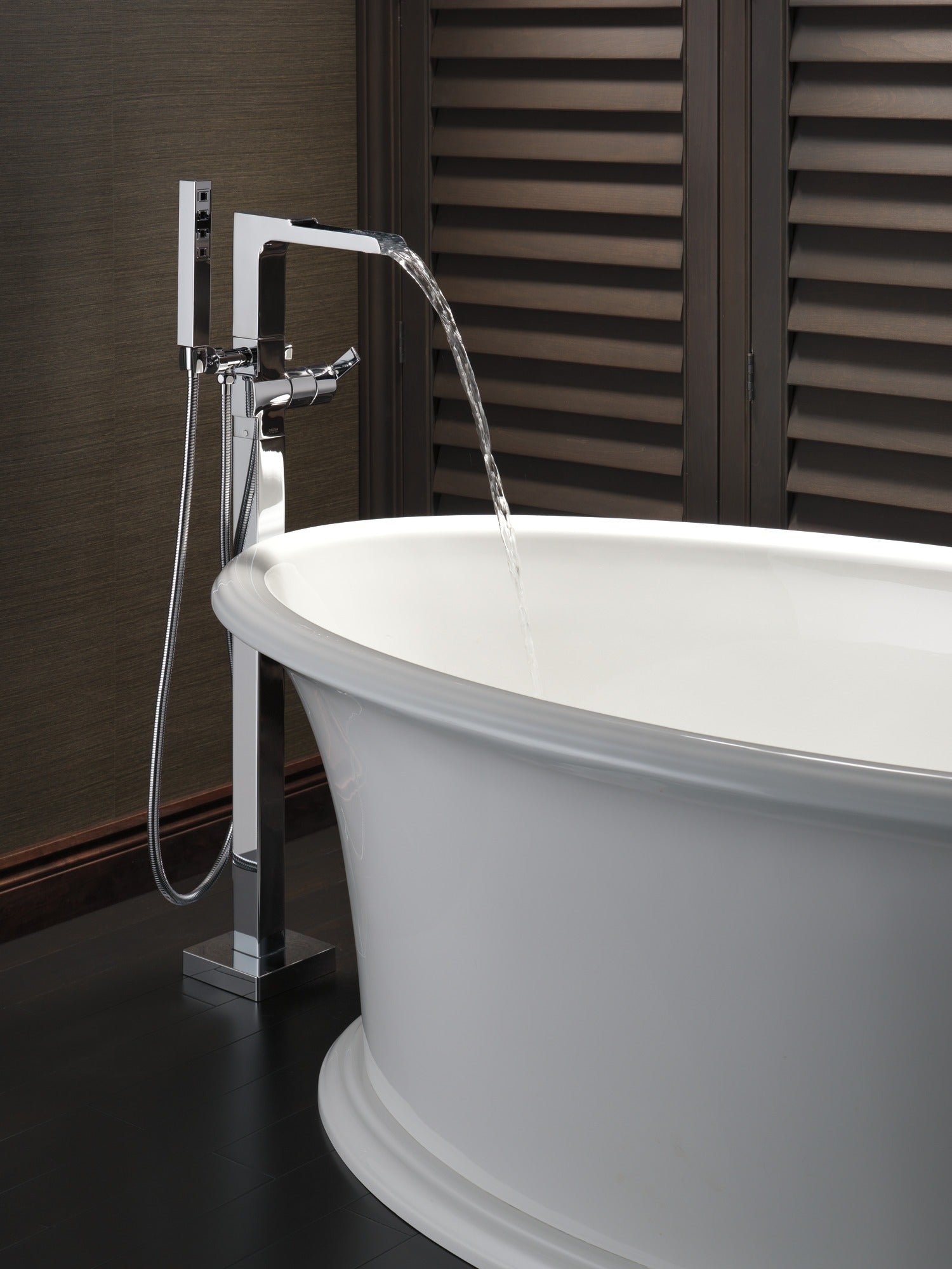 Delta Ara® Single Handle Floor Mount Channel Spout Tub Filler Trim with Hand Shower