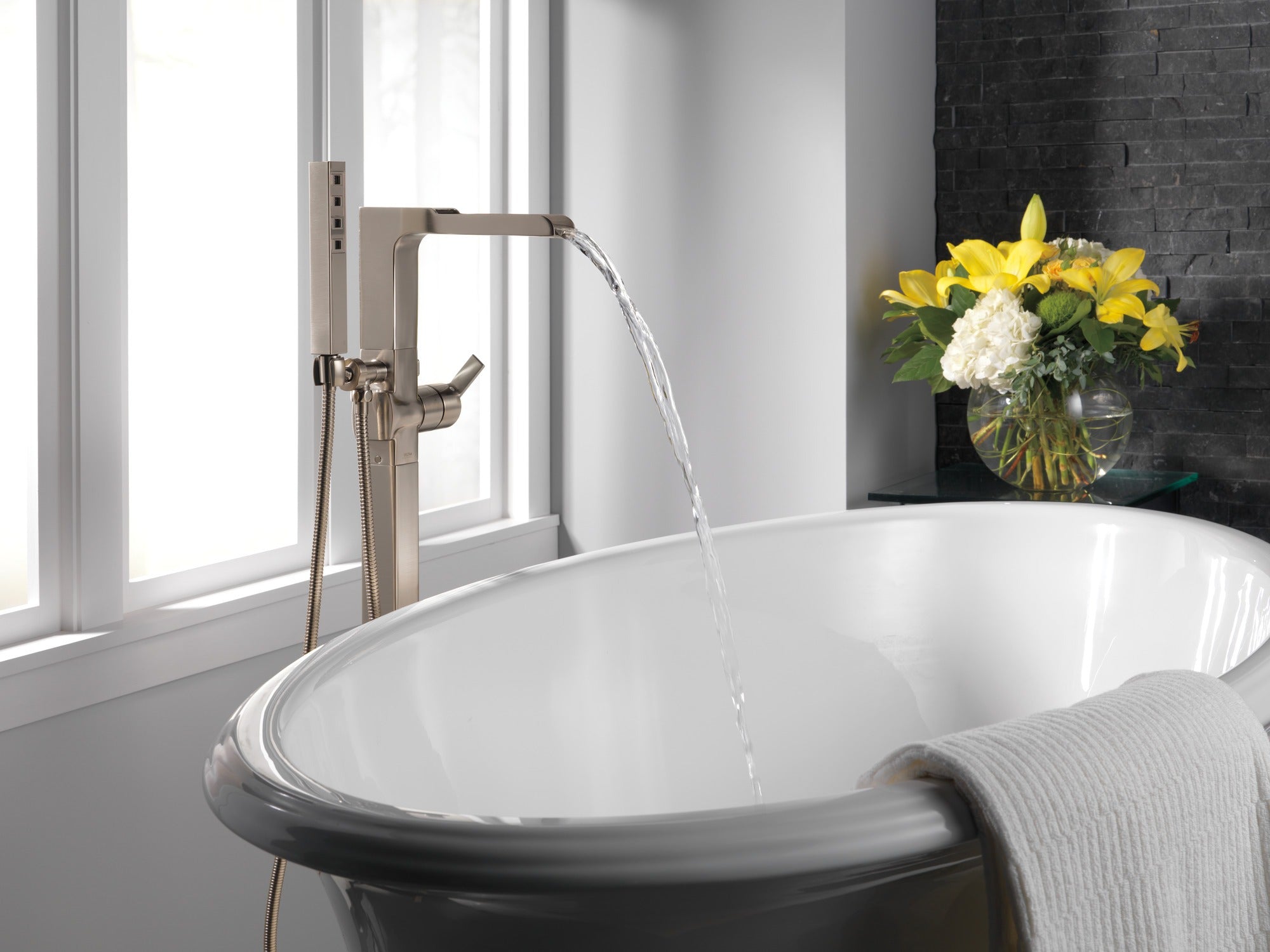 Delta Ara® Single Handle Floor Mount Channel Spout Tub Filler Trim with Hand Shower