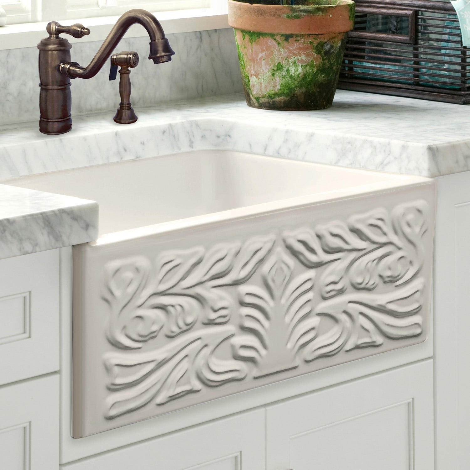 Farmhaus Fireclay Reversible Sink with a Gothichaus Swirl Design Front Apron on One Side, and a Fluted Front Apron on the Opposite Side.