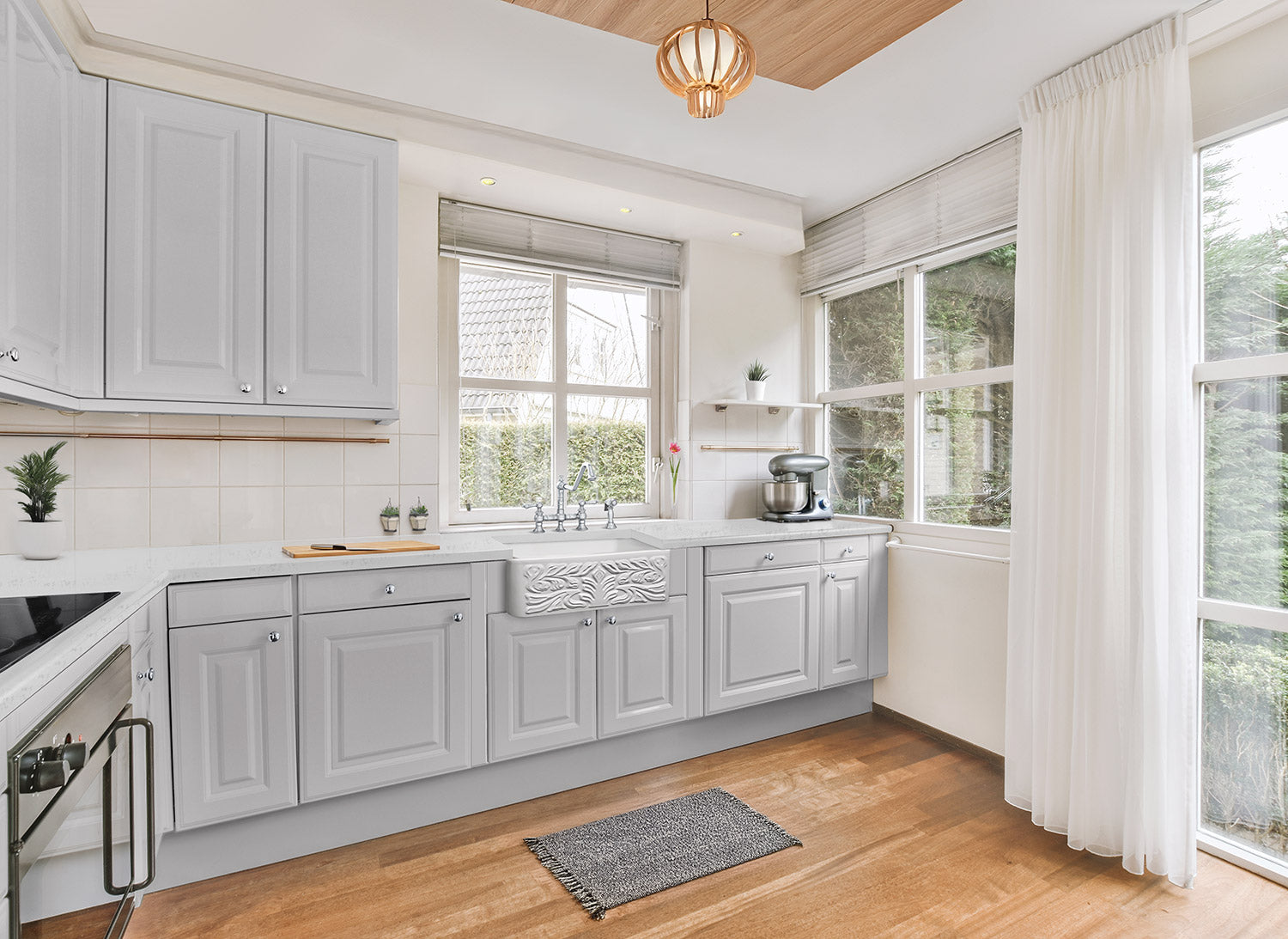 Farmhaus Fireclay Reversible Sink with a Gothichaus Swirl Design Front Apron on One Side, and a Fluted Front Apron on the Opposite Side.