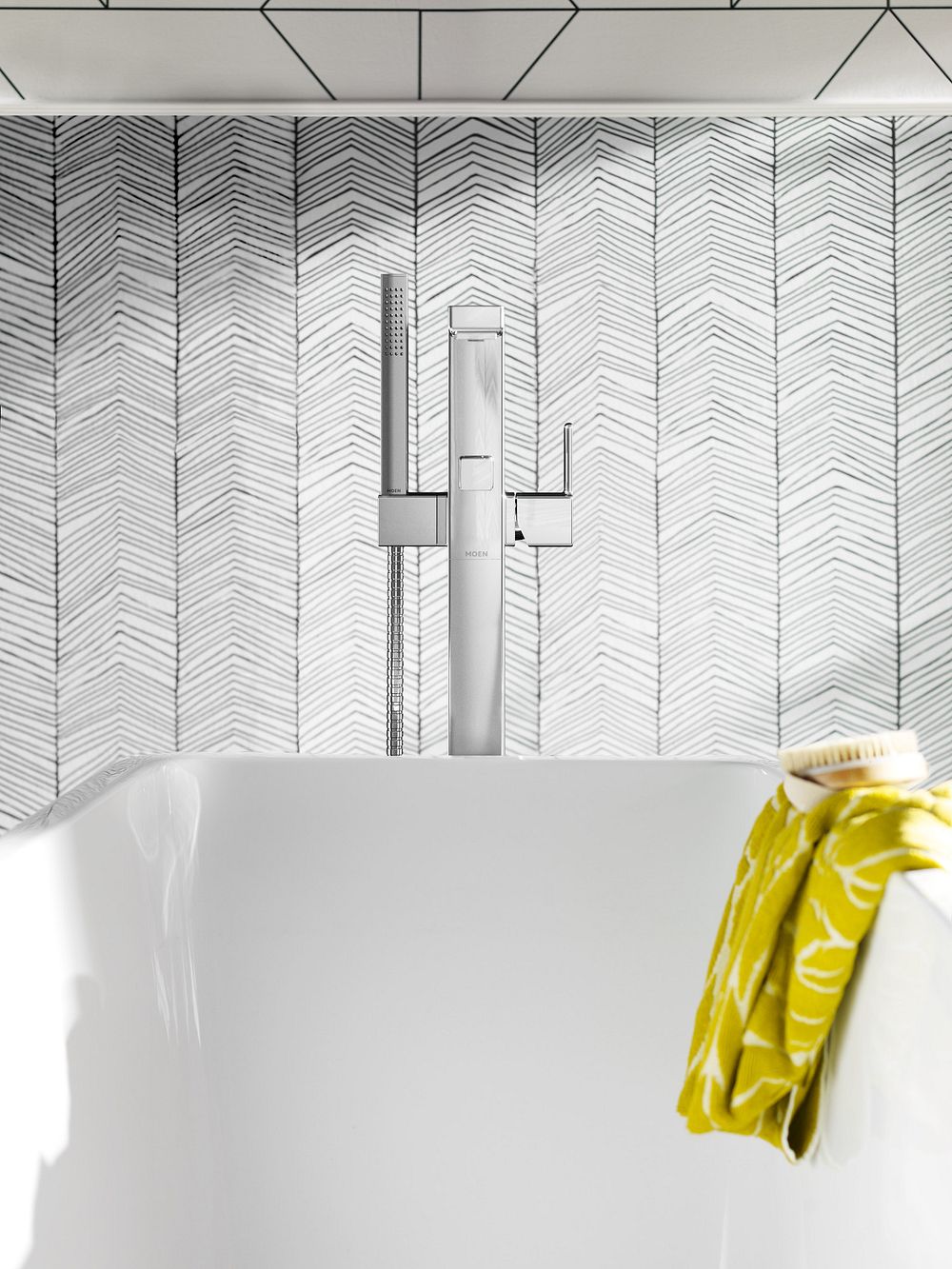 90 Degree one-handle tub filler includes hand shower
